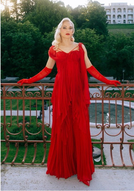 Janja Garnbret Shines Like a Goddess in Sustainable Red Gown designed by benedetti.info